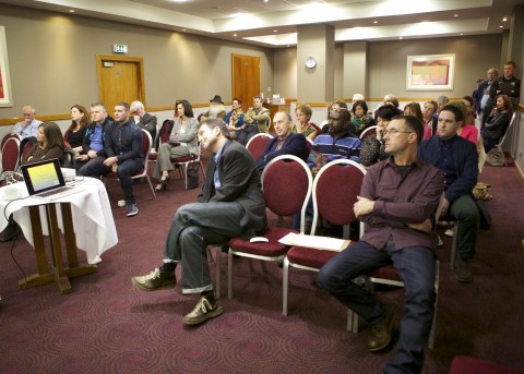Audience listens to Collette Nulty's Address